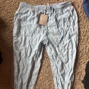 Brand new denim pants with white flowers